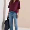 Blouse met gespleten hals en elastische zoom