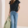 Blouse met hangende schouder en borduursel
