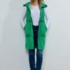Lange bodywarmer met mesh